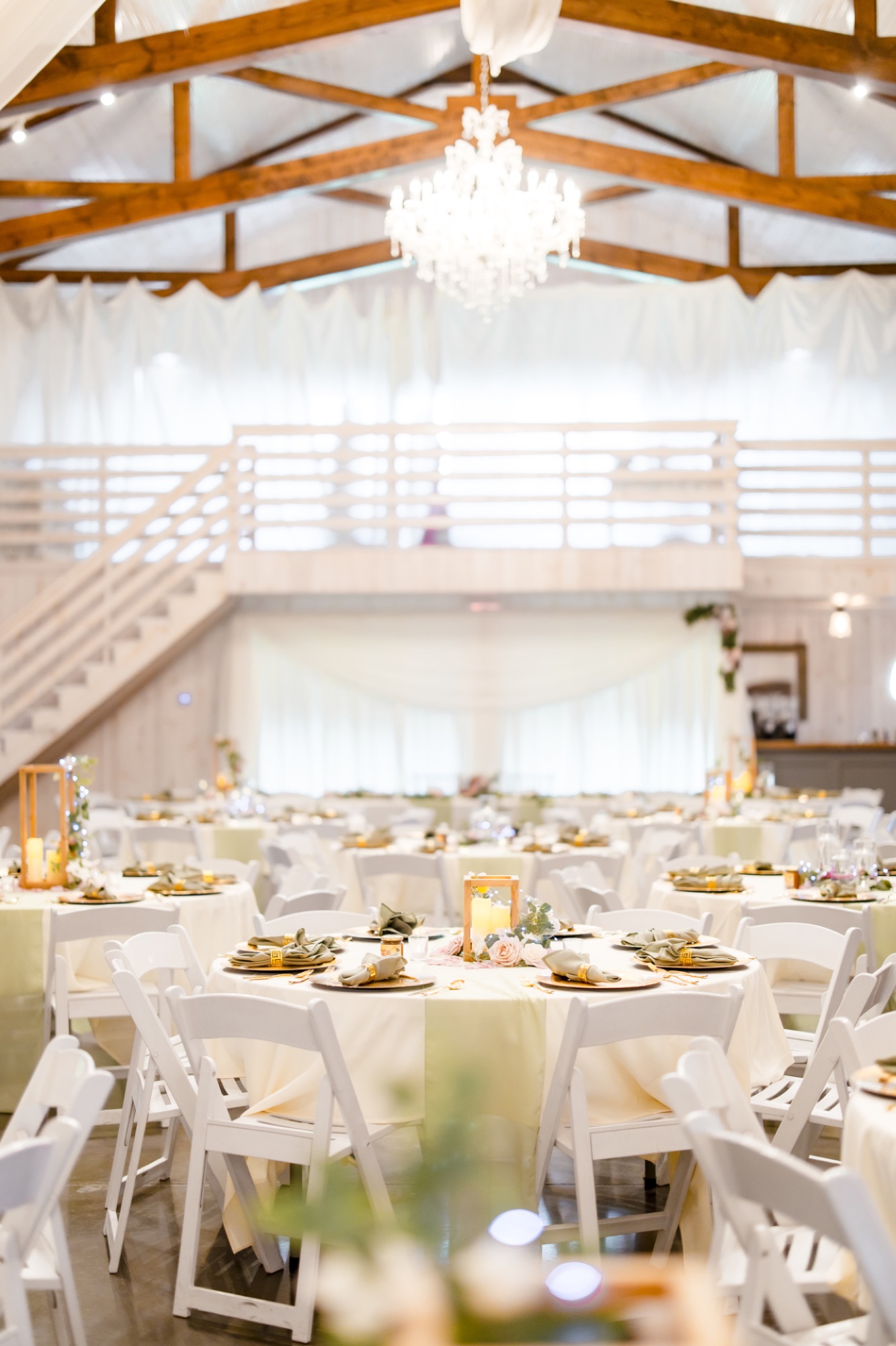 Reception lighting inside the barn at Abram Farms