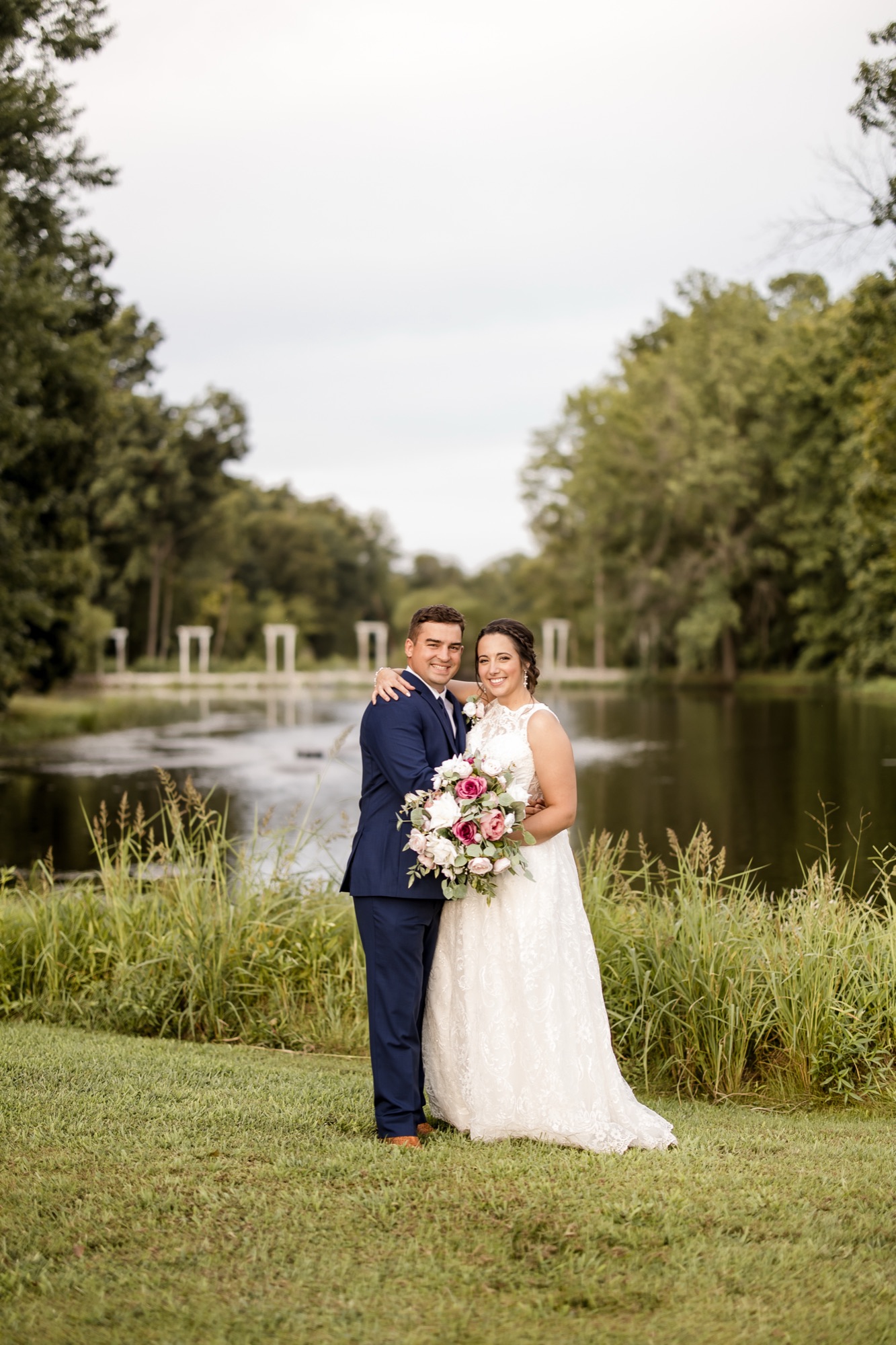 Couple at the pond's edge at Abram Farms