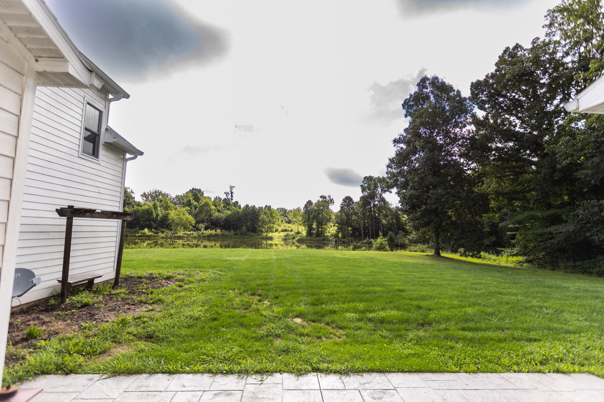Backyard view of the pond and grounds from Lakeside Manor