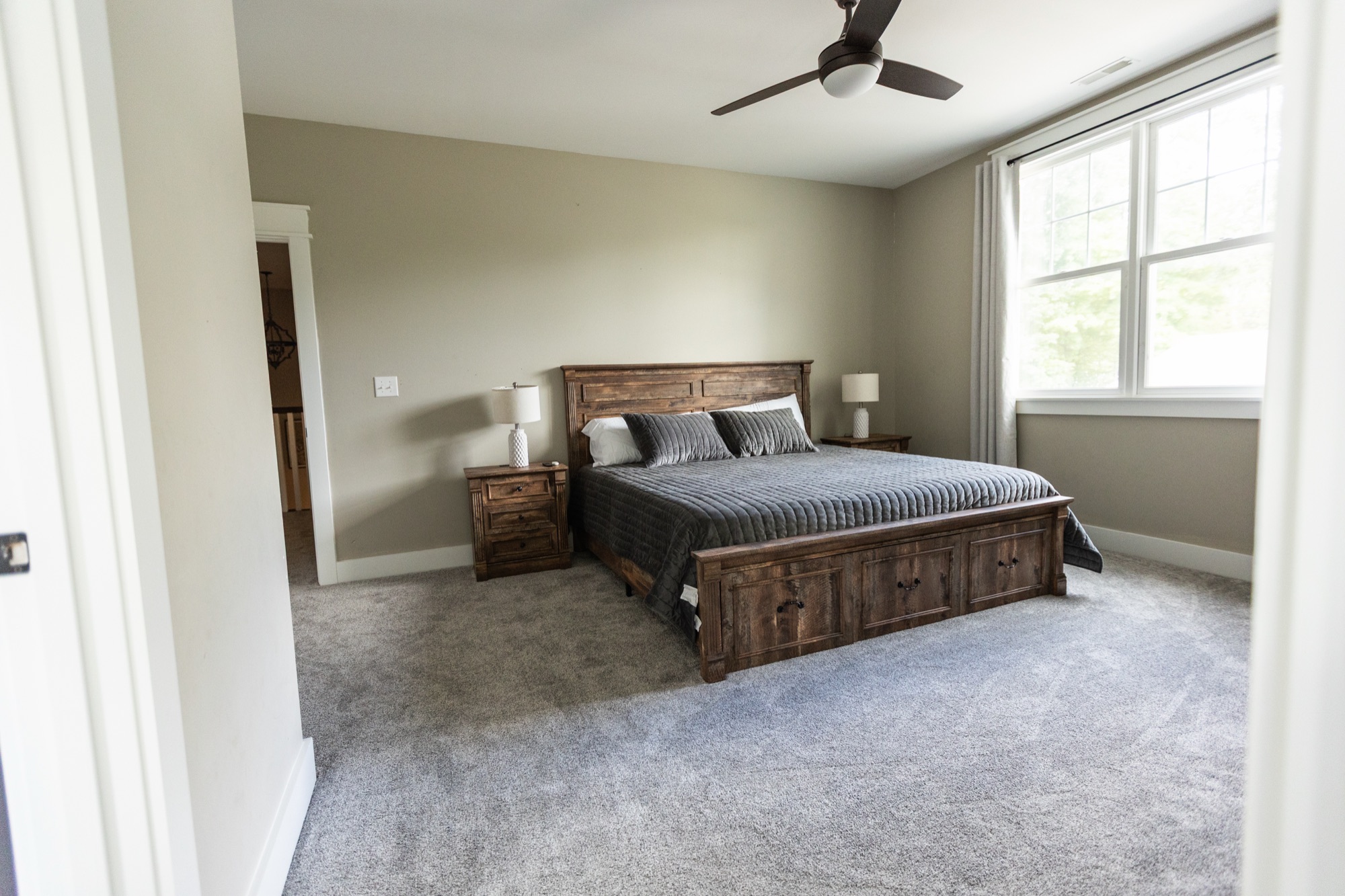 Bedroom at Lakeside Manor with a wood storage bed frame