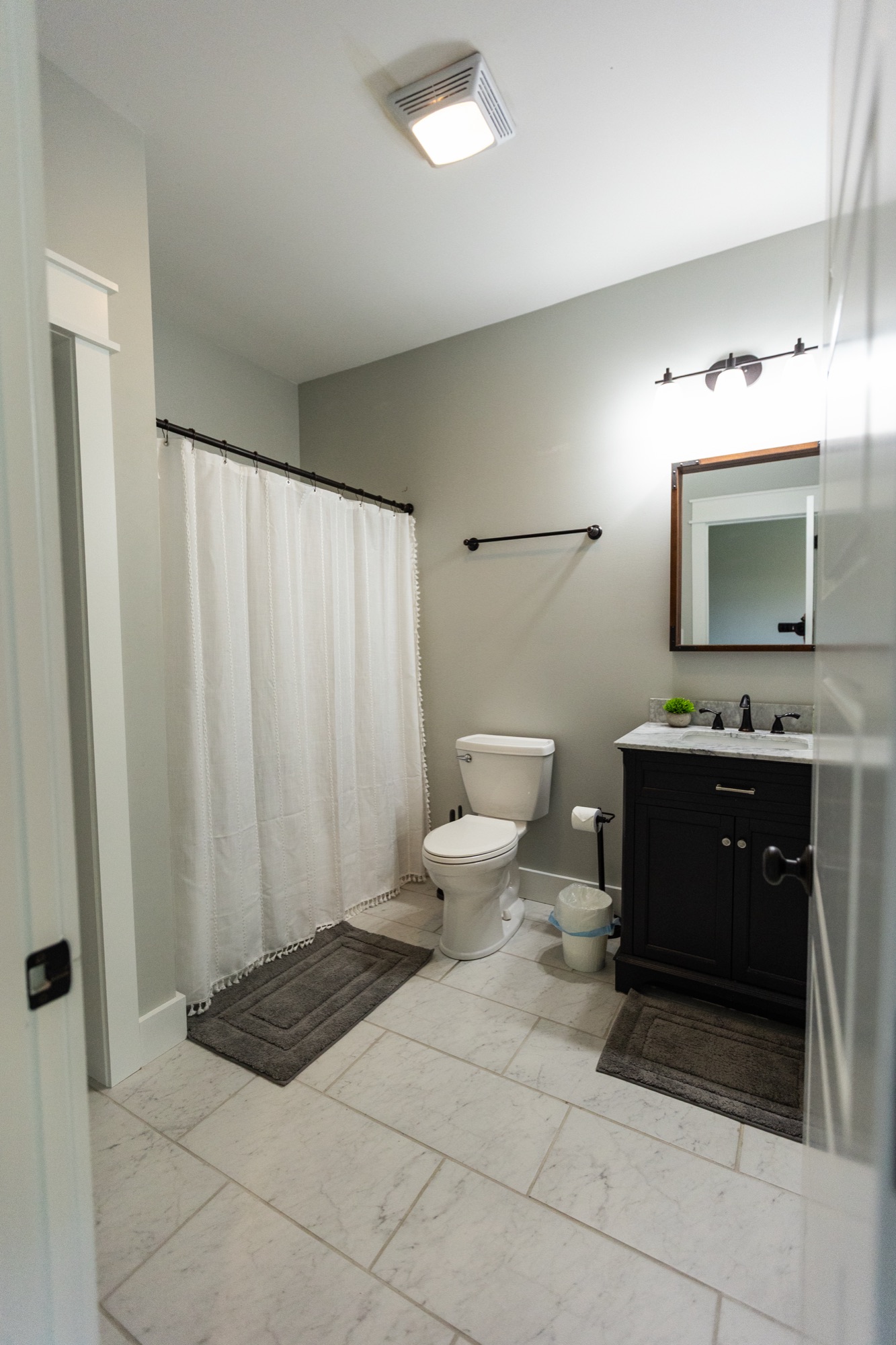 Bathroom at Lakeside Manor with shower and vanity mirror