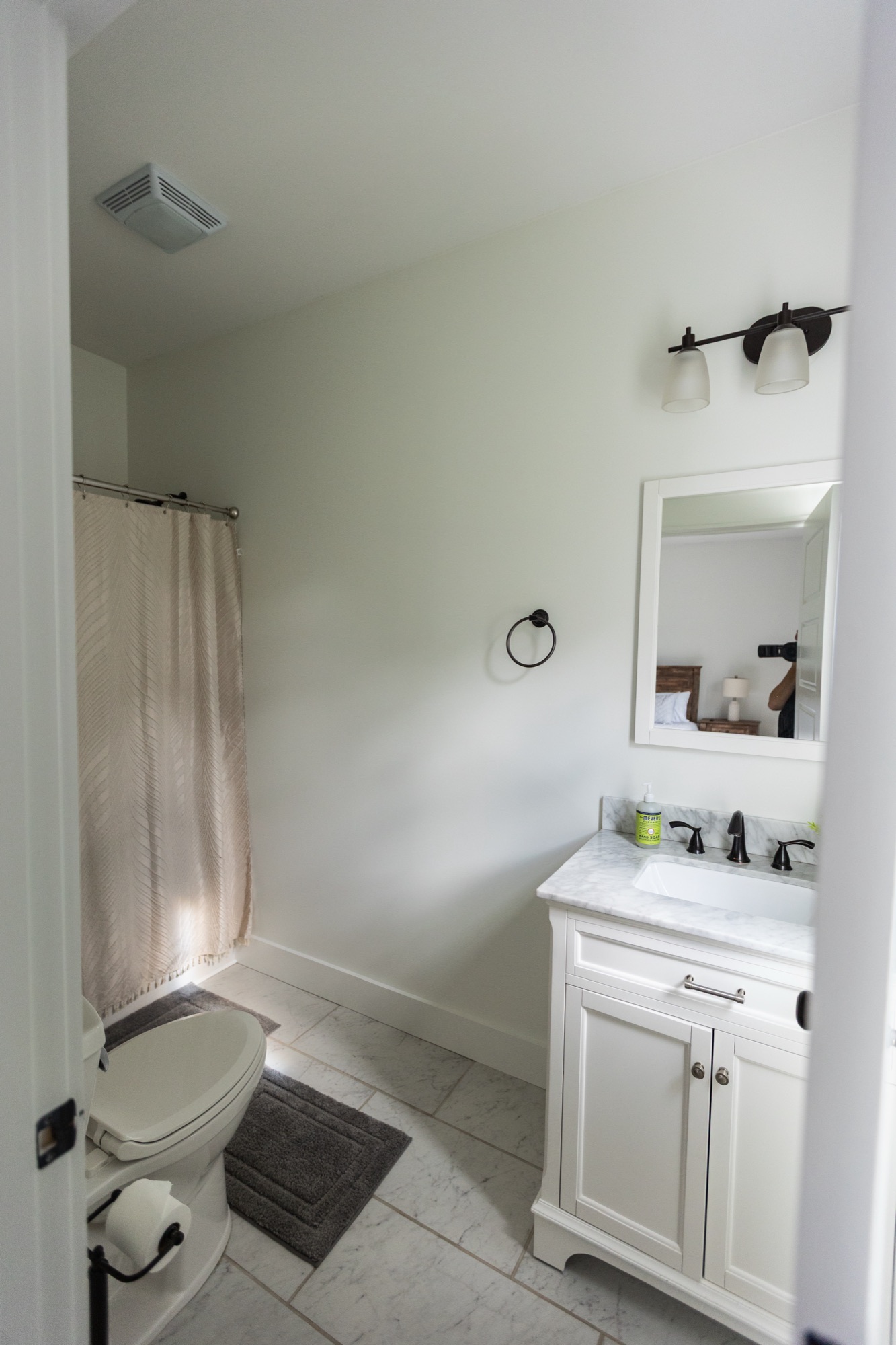 En-suite bathroom at Lakeside Manor with a white vanity