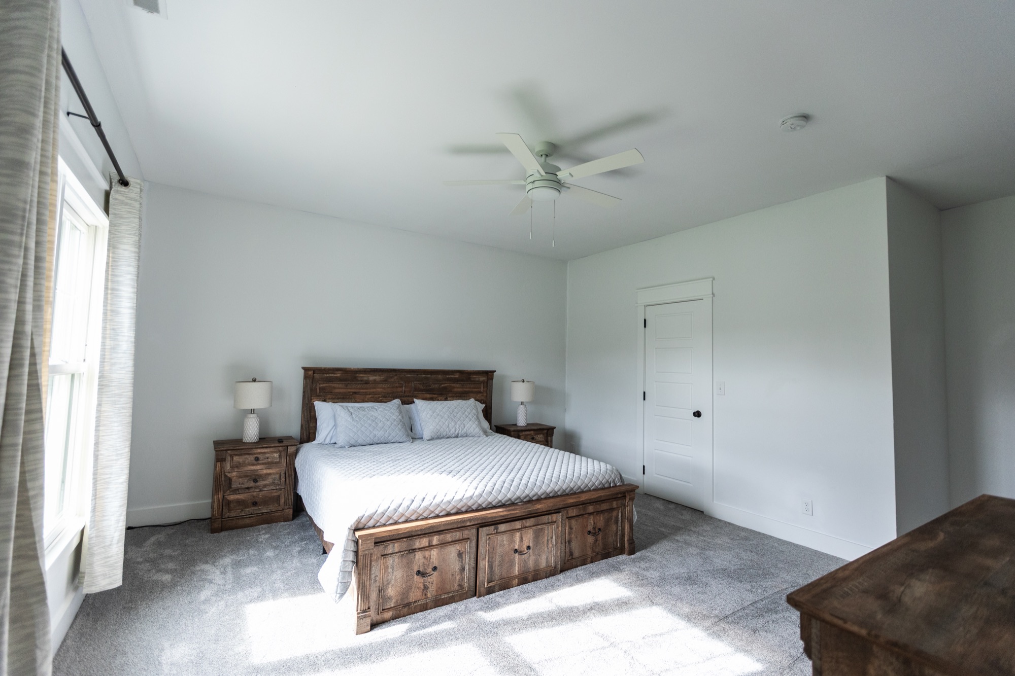 Bedroom at Lakeside Manor with a storage bed and matching nightstands