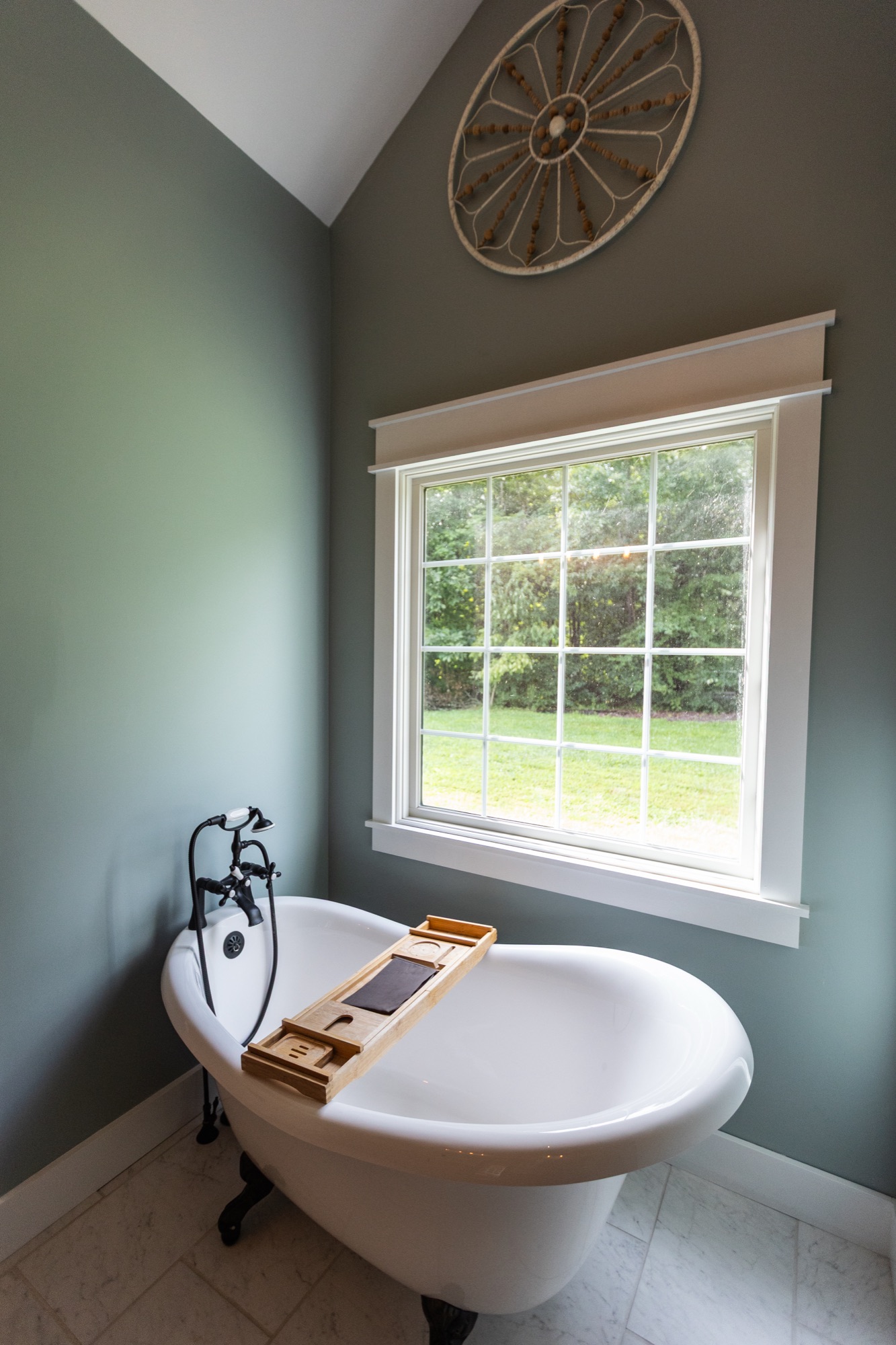 Soaking tub at Lakeside Manor with a garden-view window