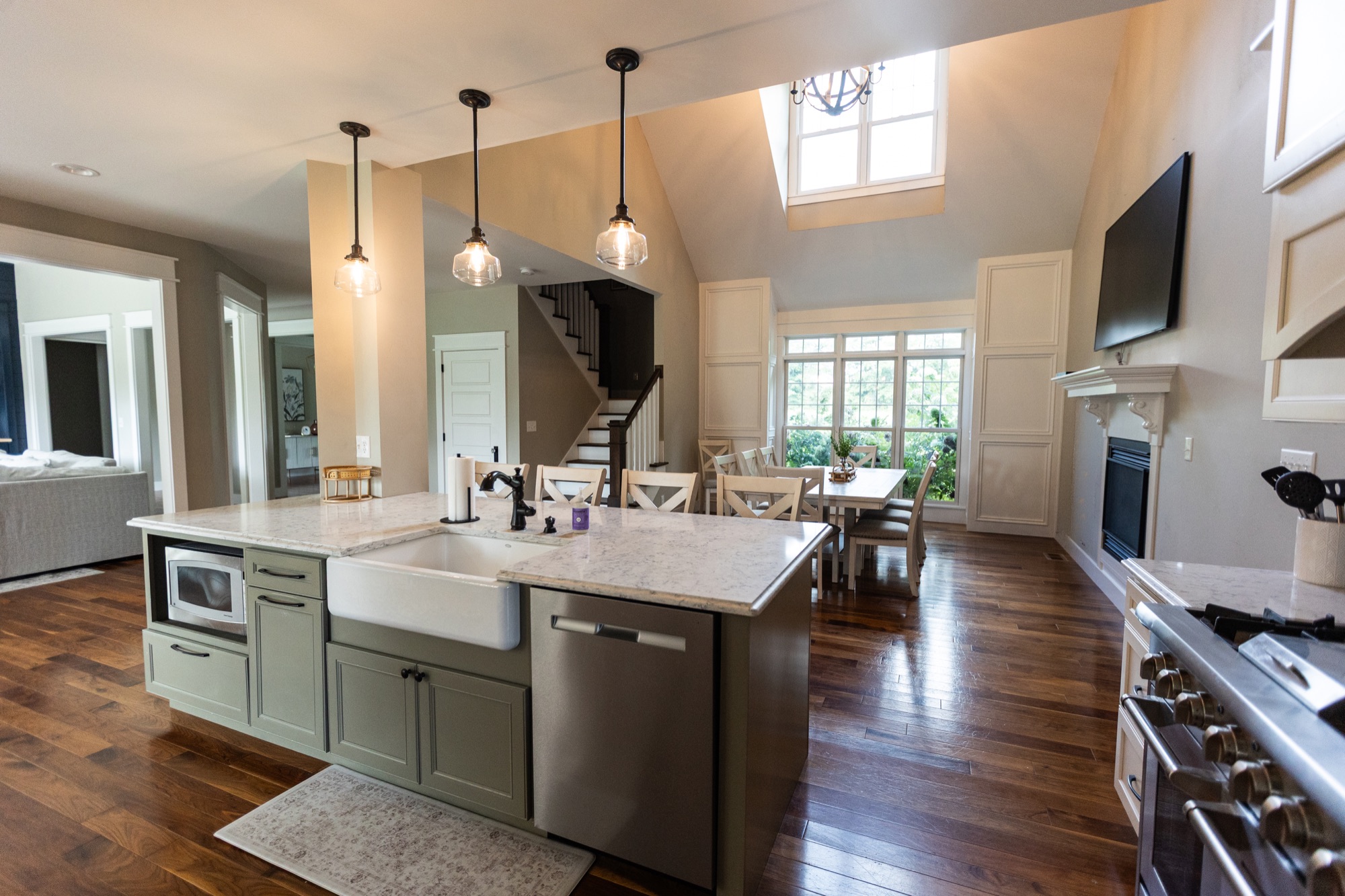 Open kitchen at Lakeside Manor with staircase to the second floor